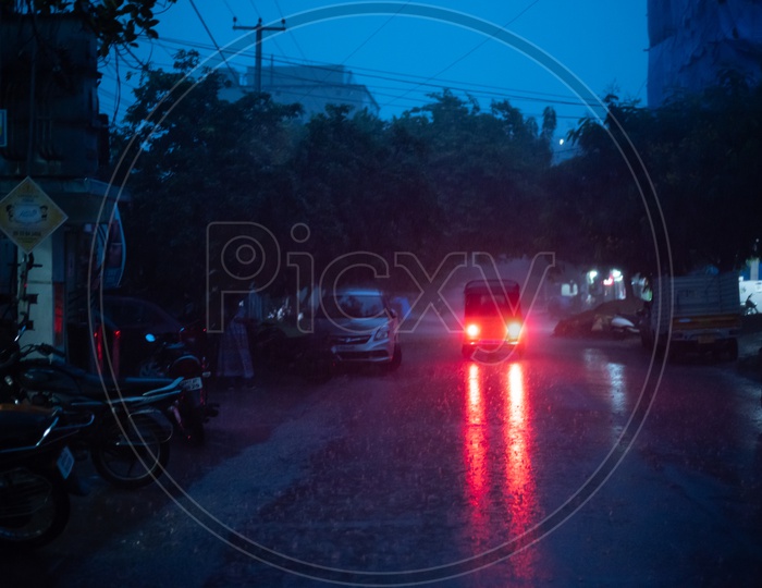 Commuting Vehicles Moving on  Hyderabad City In Heavy Rain