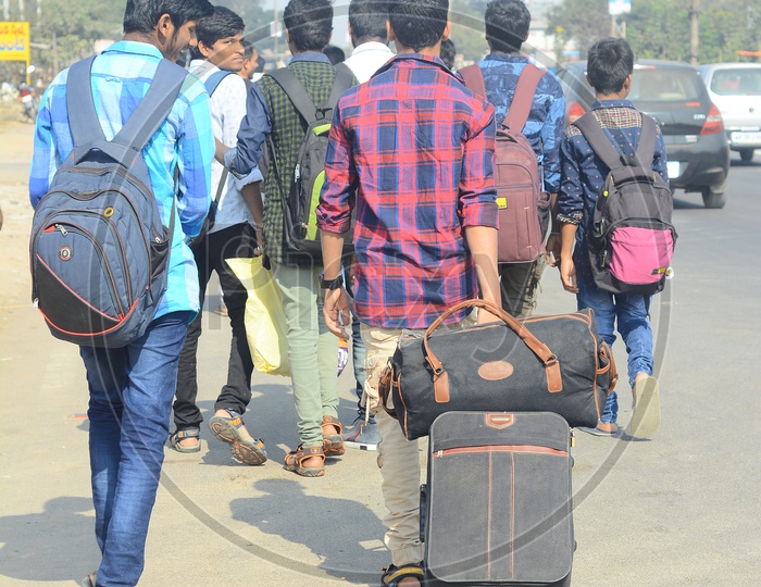 College Students Leaving to Homes With Luggage Bags For Vacations or Holidays