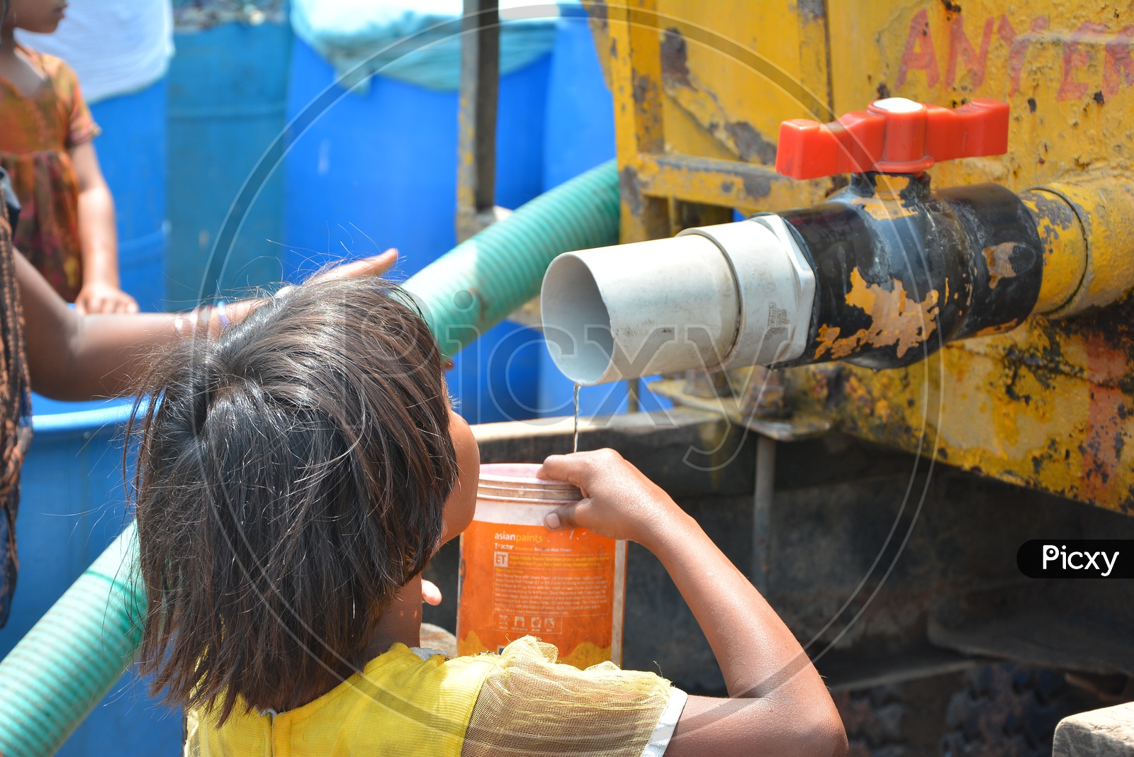Water Problem or Drinking water Crisis  In Hyderabad With Young Children Taking Water  from Water Tank Leakage  For drinking