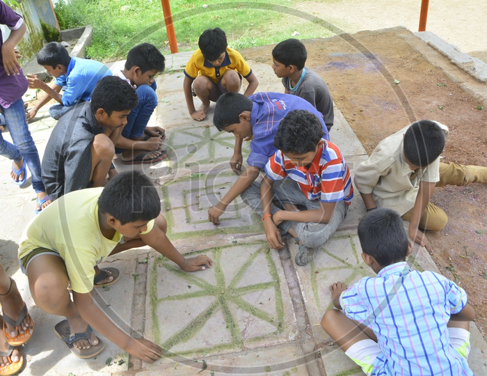 Young Children Playing Board Games In Rural Indian Villages