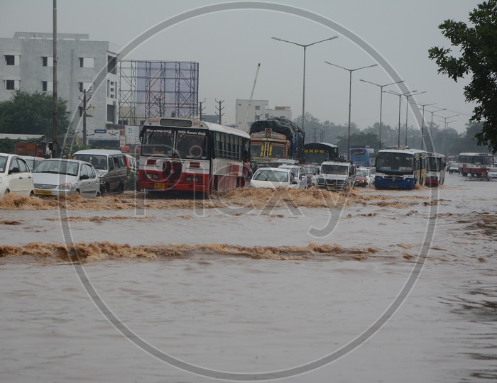 Flooded Roads Of Hyderabad With Drowned Commuting Vehicles  Due to Heavy Rains
