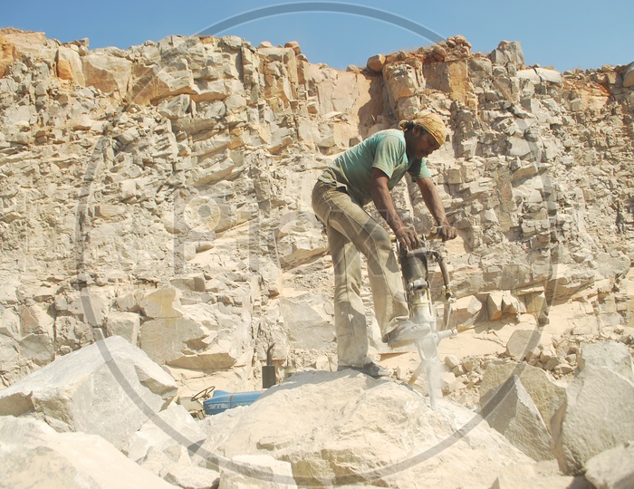 Drilling Worker Working at Rock or Stone Quarry