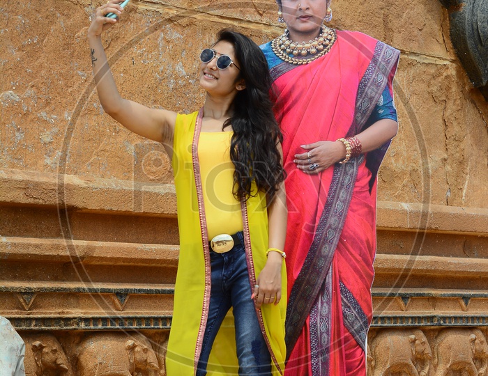 Young Indian Woman Taking Selfie With Bahubali Movie Character Shivagami Statue In ramoji Film City