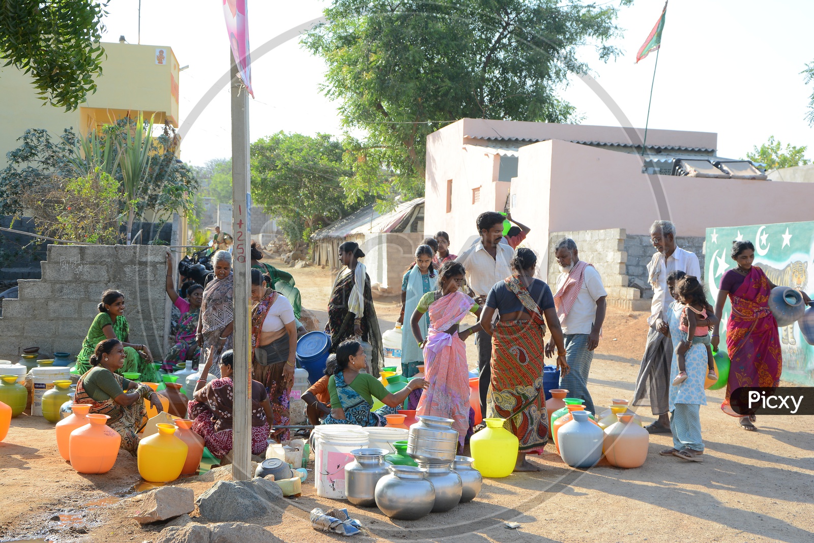 Woman In Queue Lines At Drinking Water Pipeline Taps For Filling Water Vessels in Water Crisis Areas Of Hyderabad