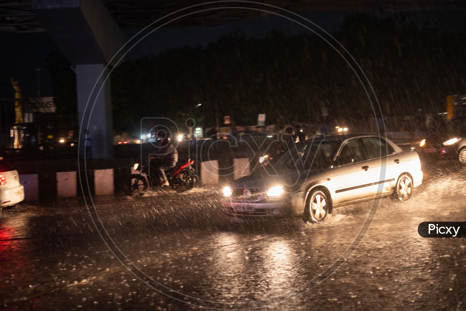 Commuting Vehicles Moving  On roads in Heavy Rains