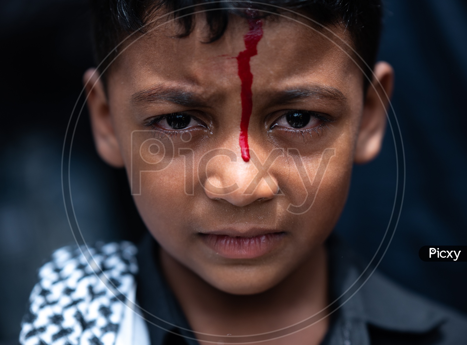 Portrait Of a Young  Boy Bleeding With Knife cut On Head During Muharram Mournings