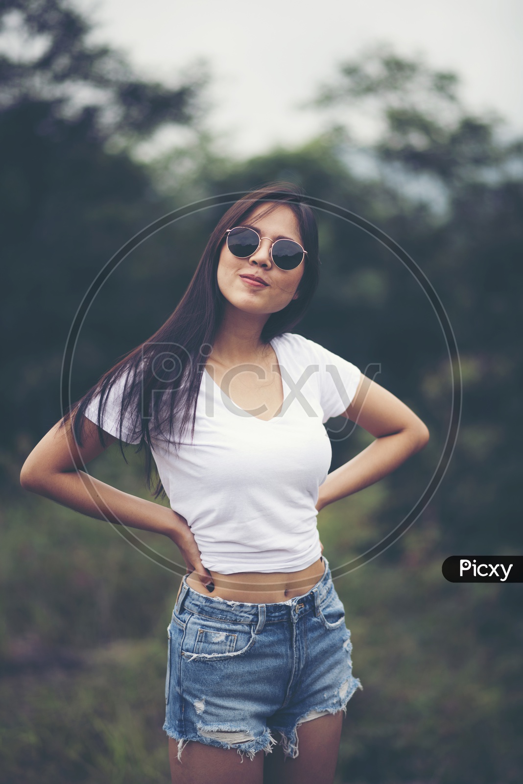 Portrait of pretty young  Asian woman standing outdoors, smile and happy