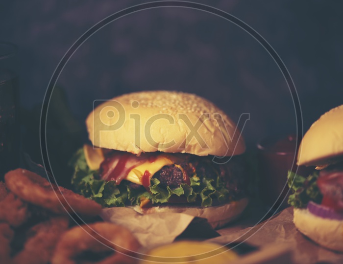 Homemade Fresh tasty burgers with cheese on Wooden Background