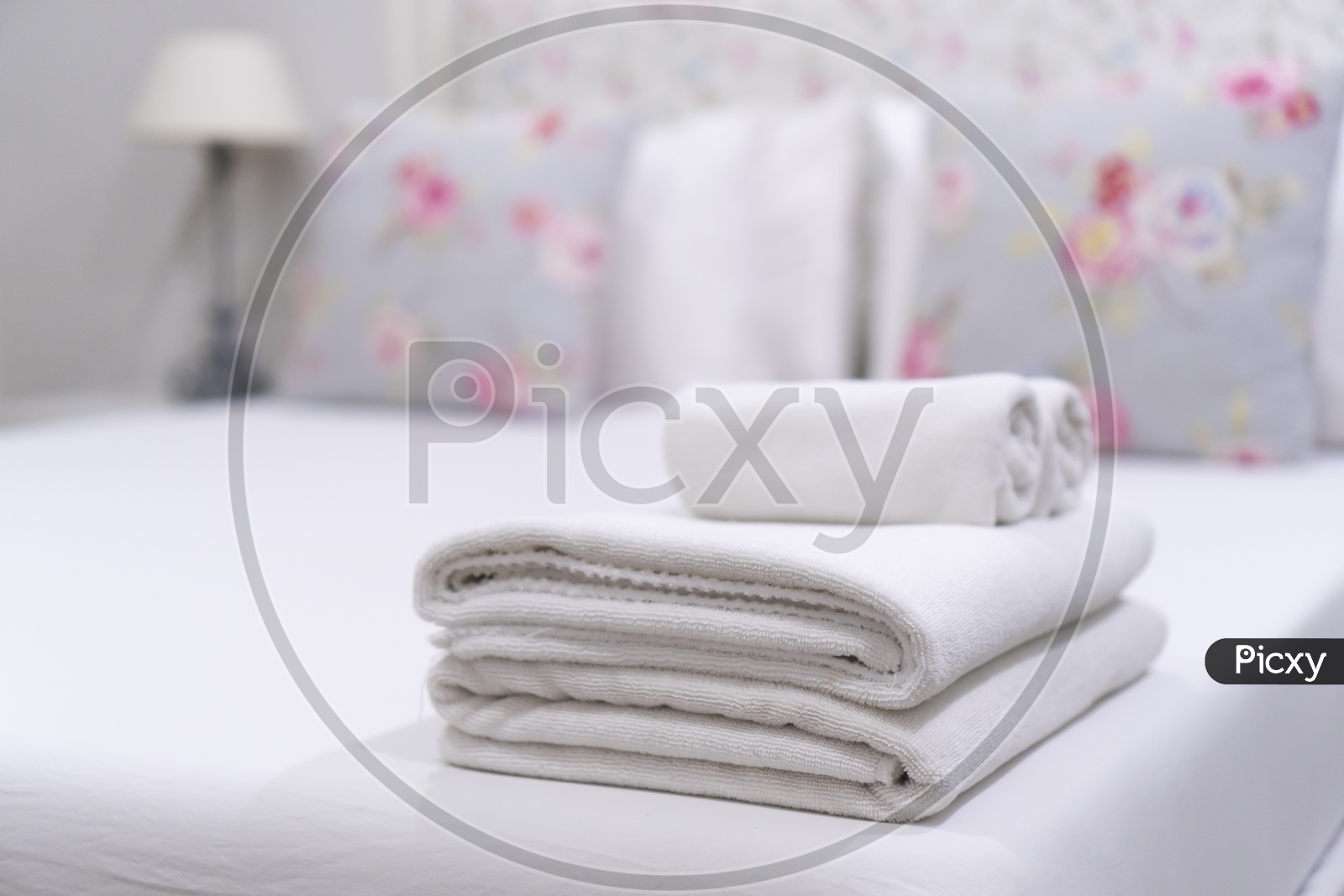 Hotel bedroom With Towels , Cushions And Bath towels