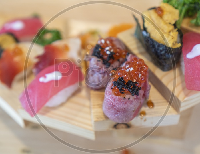 Japanese Cuisine, Fresh Sushi Sashimi on Wooden Background