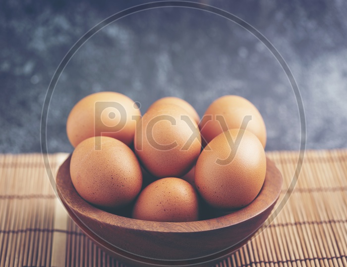 Brown Eggs in a Wooden Bowl