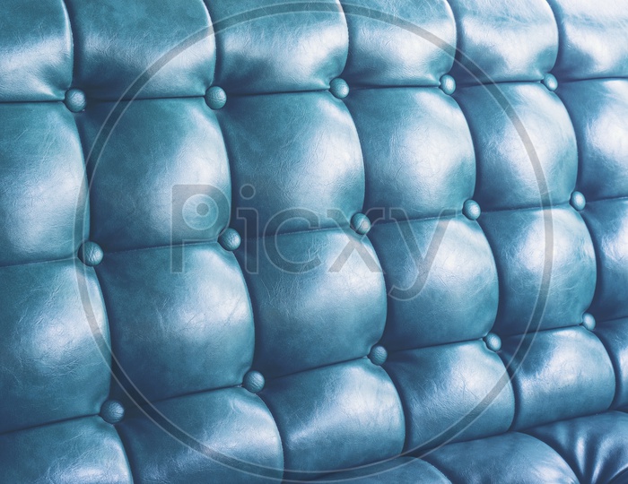 blue leather texture background with buttoned pattern