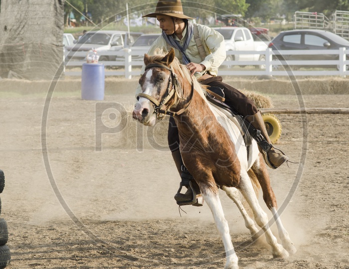 Horseman Or Equestrian Riding Or training Horse In a Coarse  Race