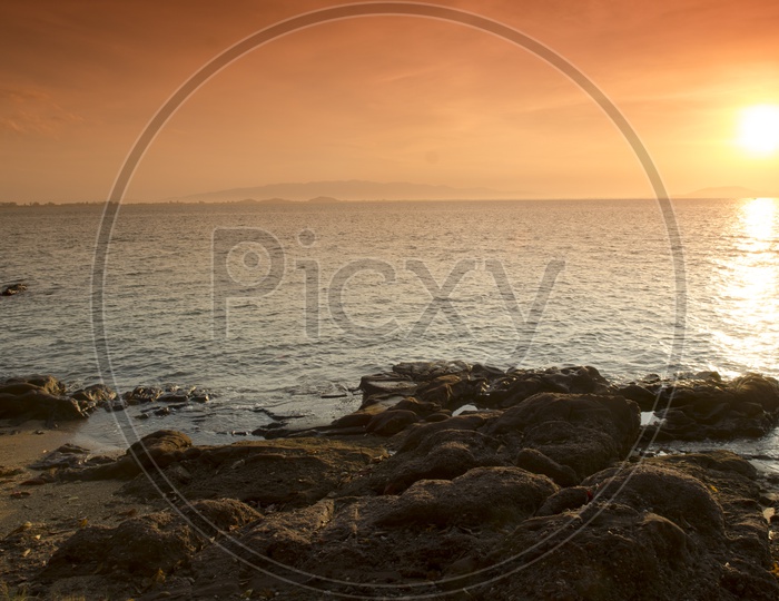 Sunset Over Tropical Sea And beach With Rocks