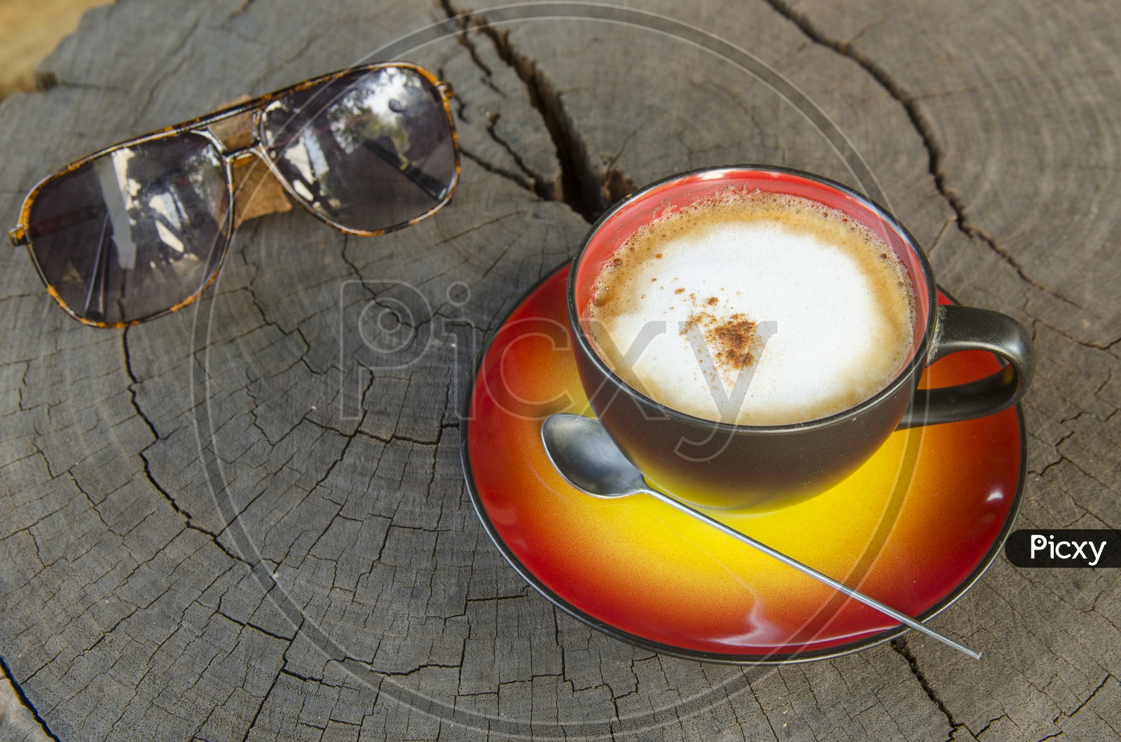 Coffee Cup And Sunglasses On Wooden Table Background