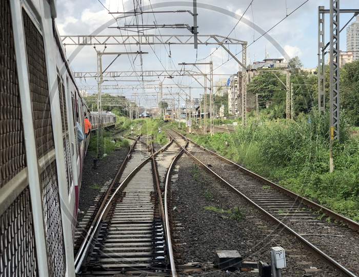 Mumbai Suburban Trains Running On tracks in Mumbai
