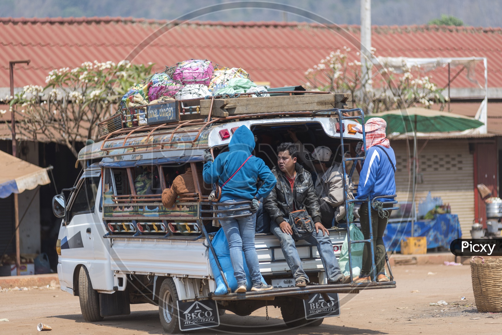 Busy Luang Prabang Morning Market With Public Commuting Jeeps  in  luang prabang Laos.
