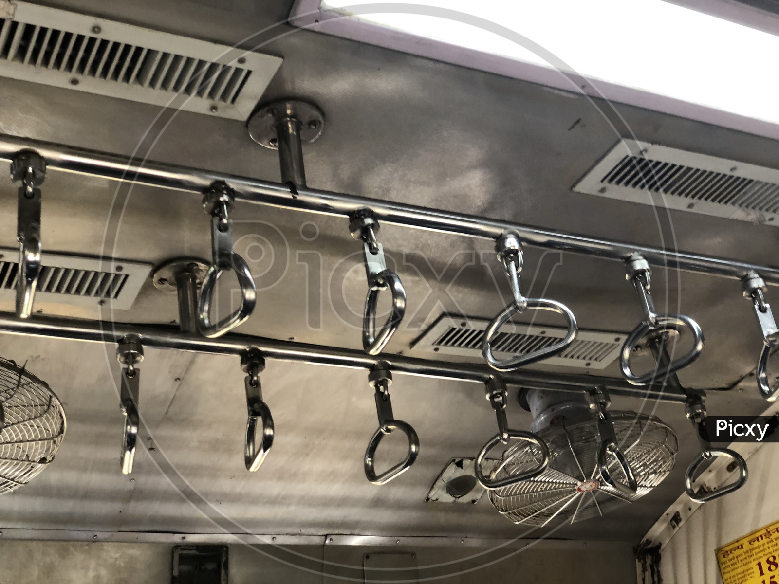 Handle Bars For Passengers Support In Mumbai Suburban Train