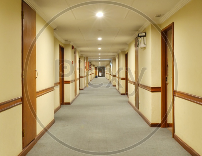 beautiful hotel corridor with carpet and Hotel Room Doors