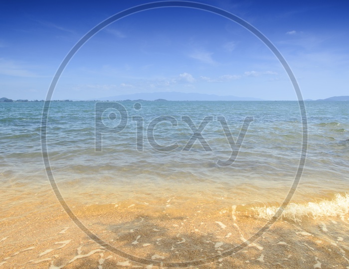 Beach And Tropical Sea With Sky Forming a Background