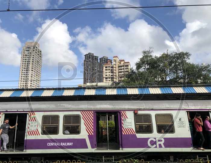 Mumbai Suburban Trains Running On tracks in Mumbai