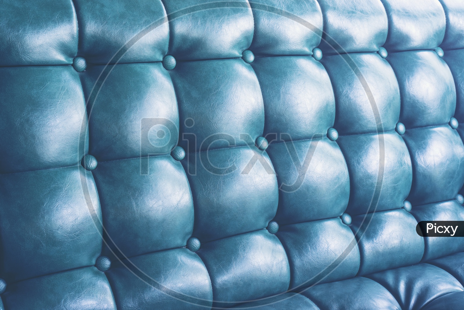 blue leather texture background with buttoned pattern
