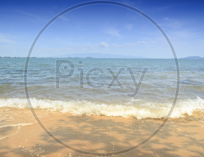 Beach And Tropical Sea With Sky Forming a Background