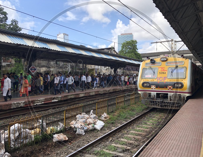Passengers Or Commuters Waiting For Local Train or Mumbai Suburban Train  At Dadar Station
