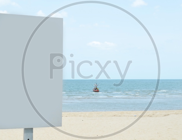 Advertising Blank Billboard With Tropical Sea and Boat