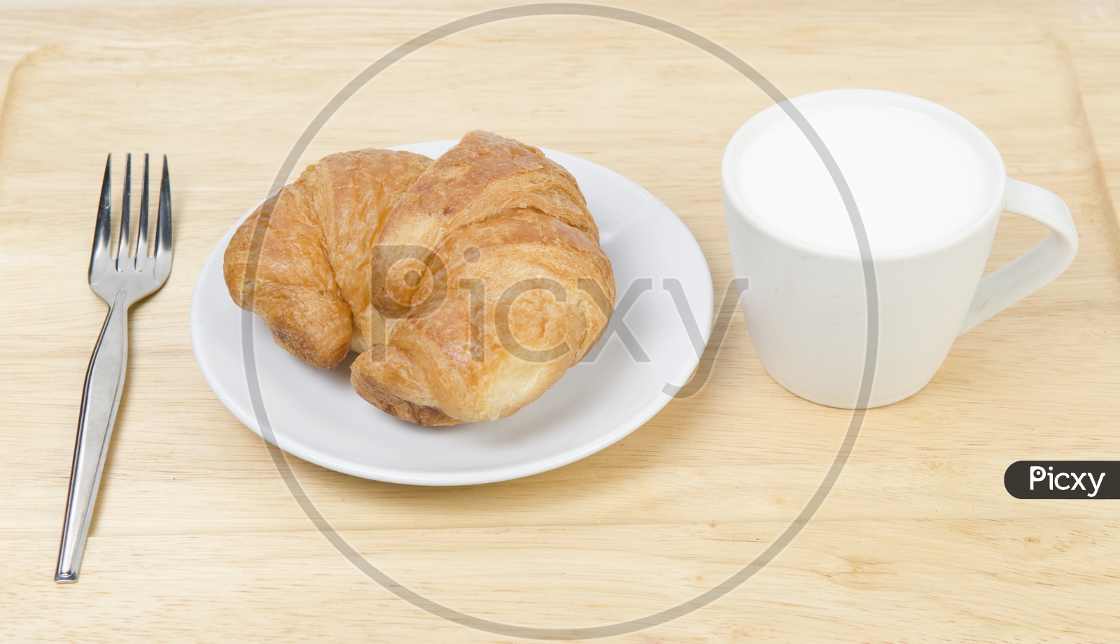 glass of milk and Croissants bread