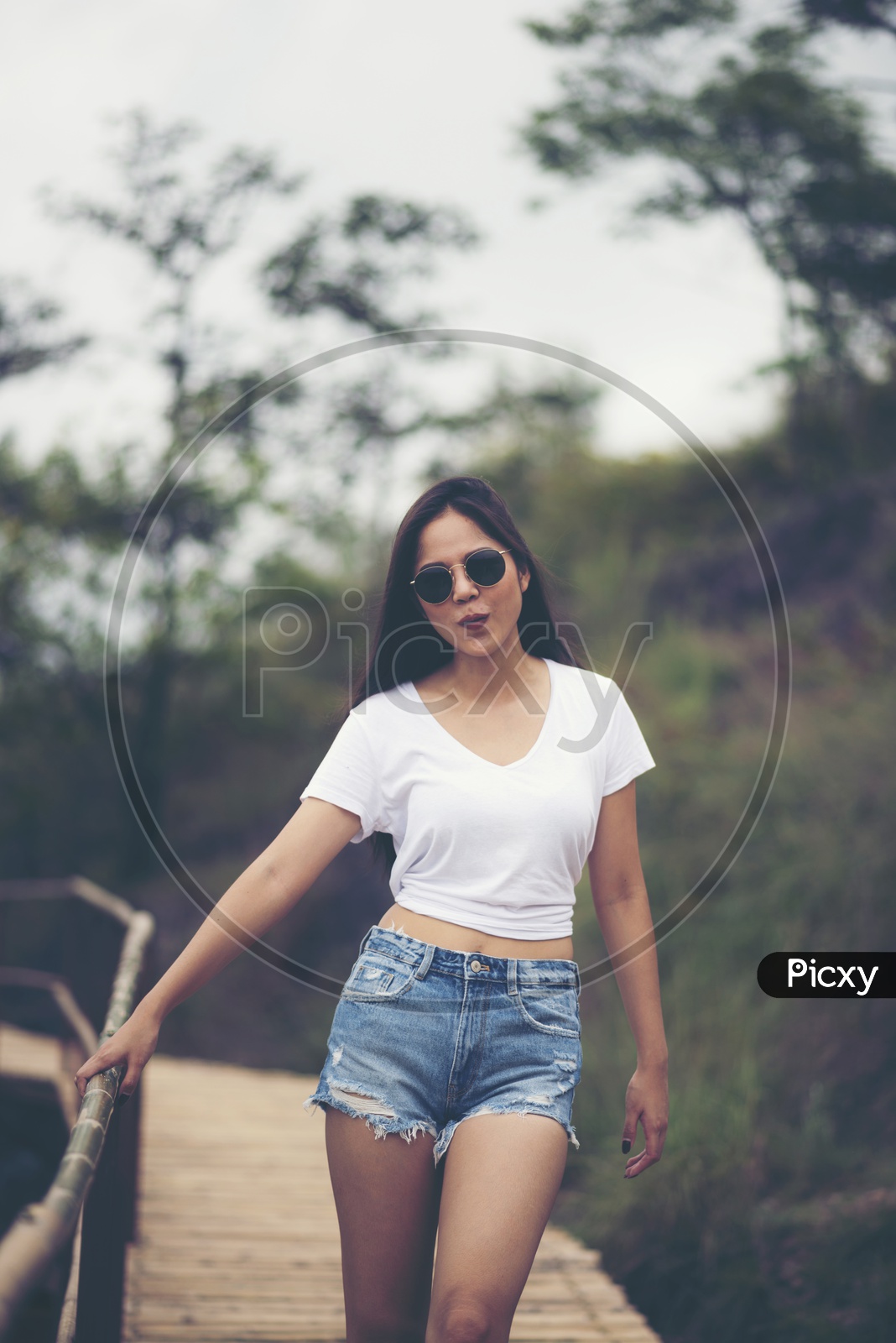 Young women are relaxing in natural areas  With Outdoor Background