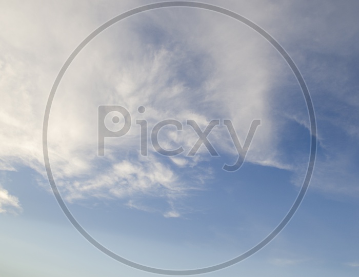 Cotton Clouds  in Blue Sky Background