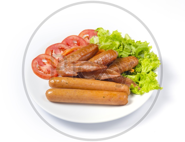 Hot Dog Decorated with Tomatoes and Green Lettuce Leaves Isolated on White Background