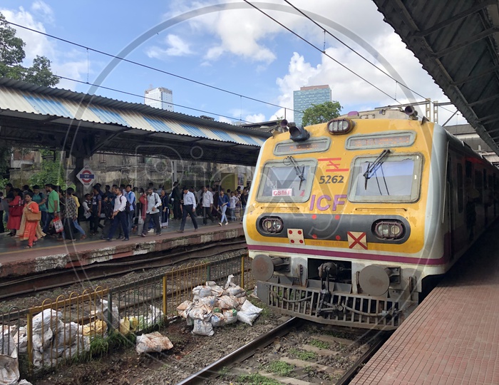Passengers Or Commuters Waiting For Local Train or Mumbai Suburban Train  At Dadar Station