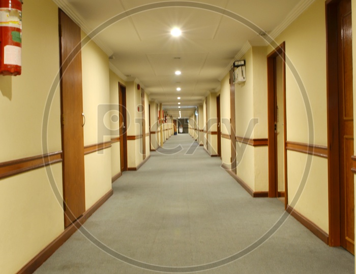 beautiful hotel corridor with carpet and Hotel Room Doors