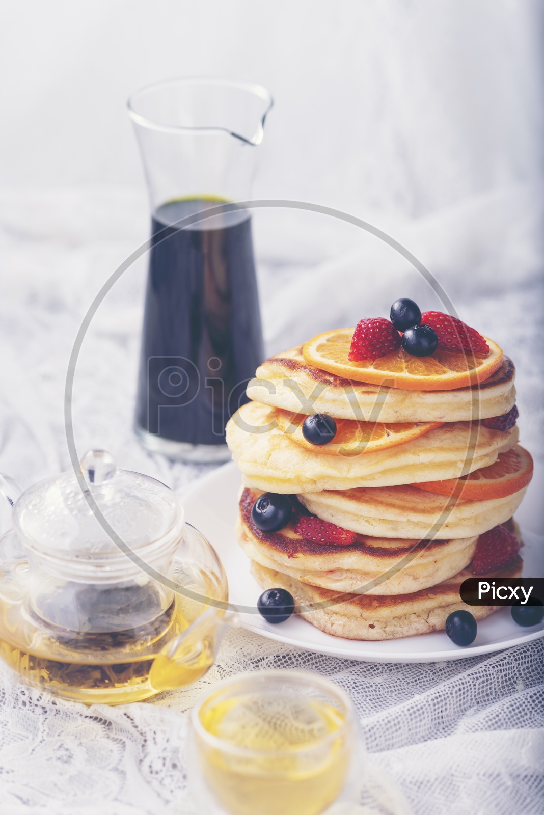 Stack of homemade thin pancakes or crepes in a Plate