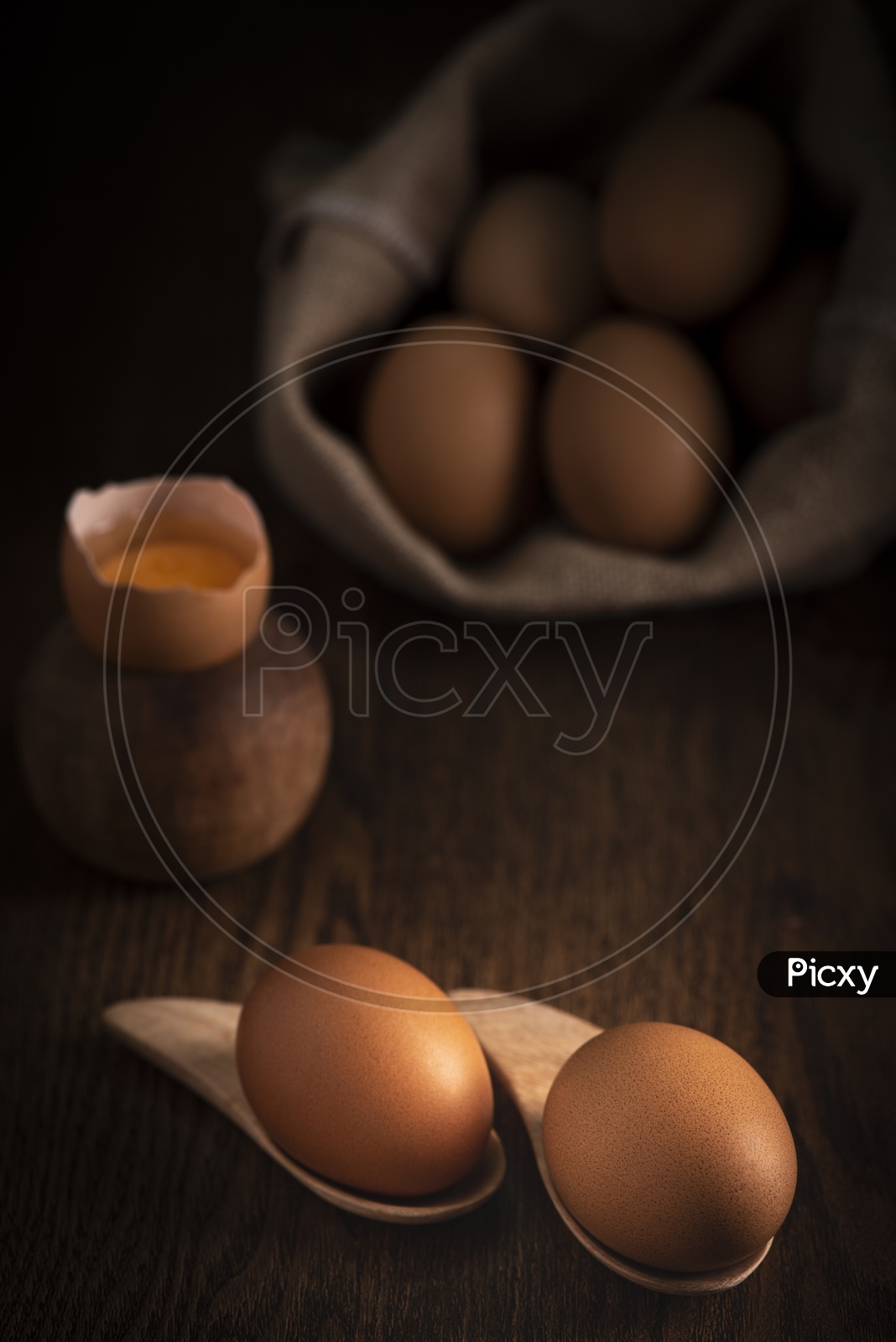Fresh Brown Eggs on Wooden Background