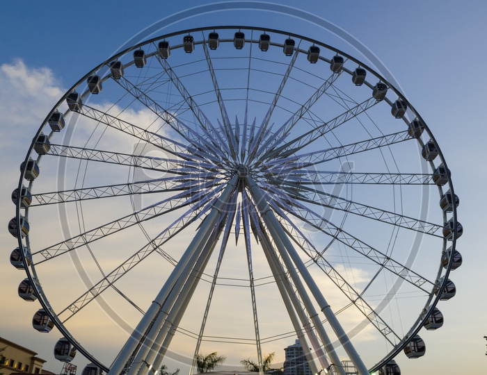 Beautiful large Ferris wheel With Sunset  Sky Background