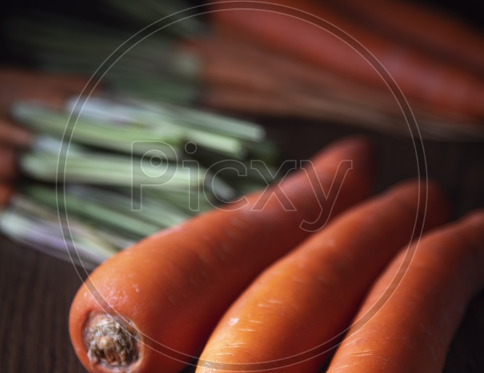 Fresh and sweet carrot on a Grey Wooden Background