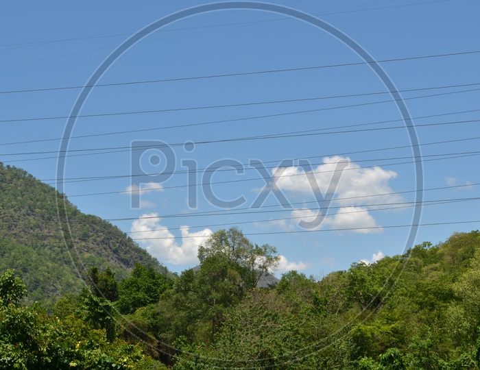 Electricity Power Cables Over Blue Sky