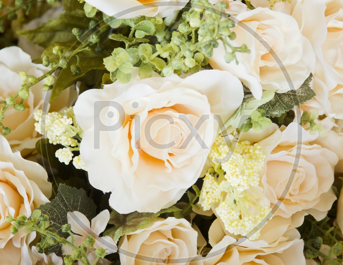 wedding bouquet with rose bush, Ranunculus asiaticus as a background