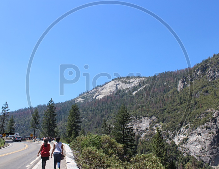 Indian Couple walking by the Yosemite Falls