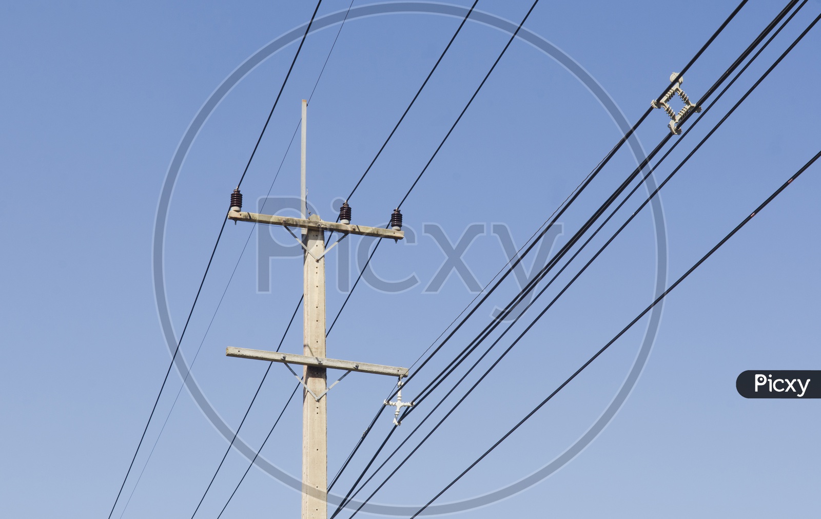 Electricity Wires With Poles Over Blue Sky