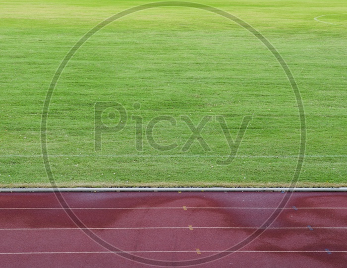 Abstract View Of Running Track And Green Field