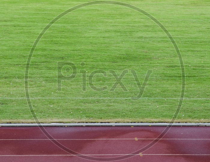 Abstract View Of Running Track And Green Field