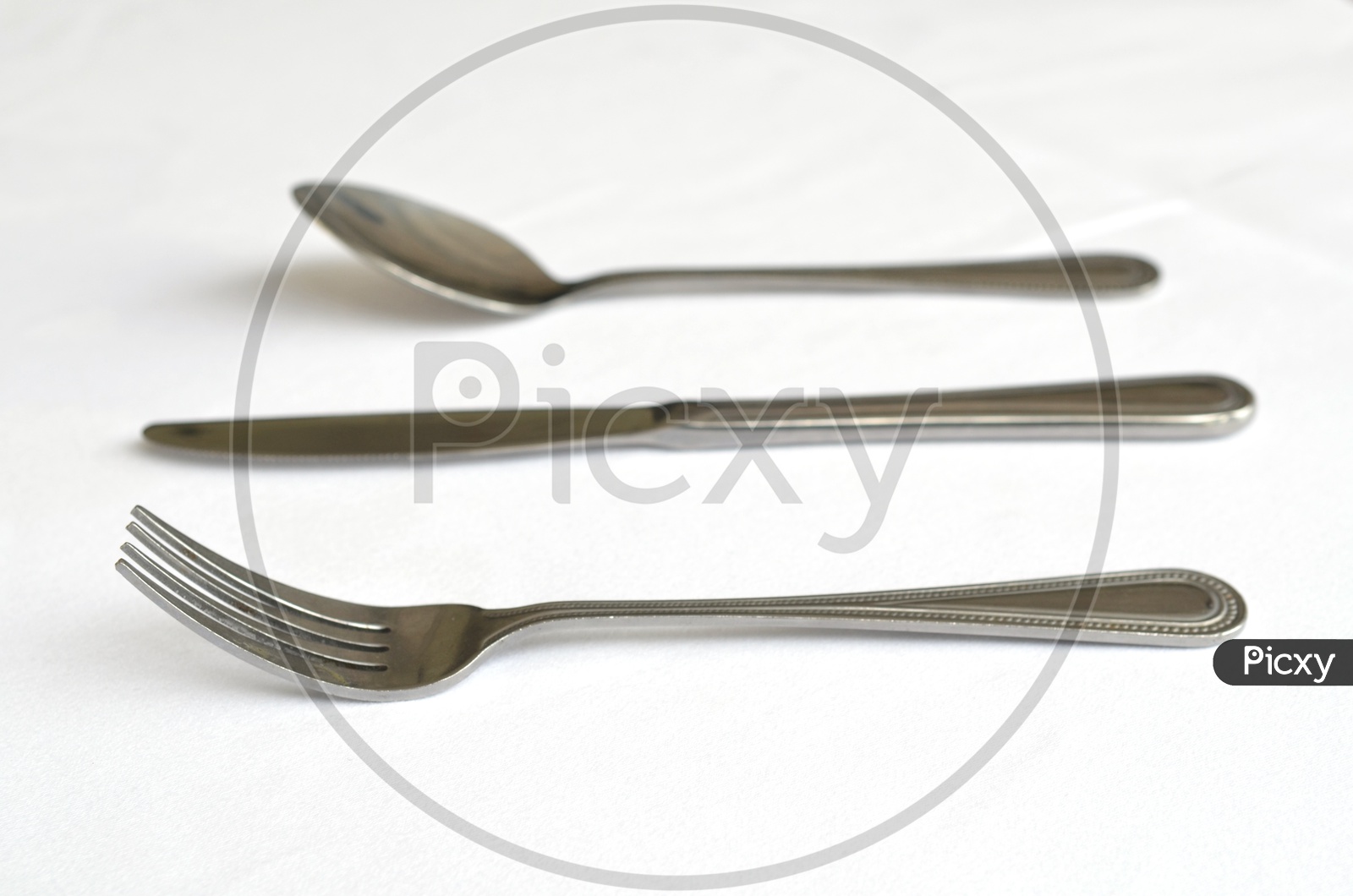 Fork spoon and knife on the table