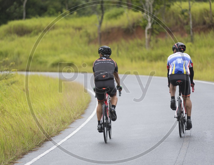 Activities of Mountain Bikers challenging themselves uphill on a Long Weekend Sporting and Fitness at Khao yai national park.