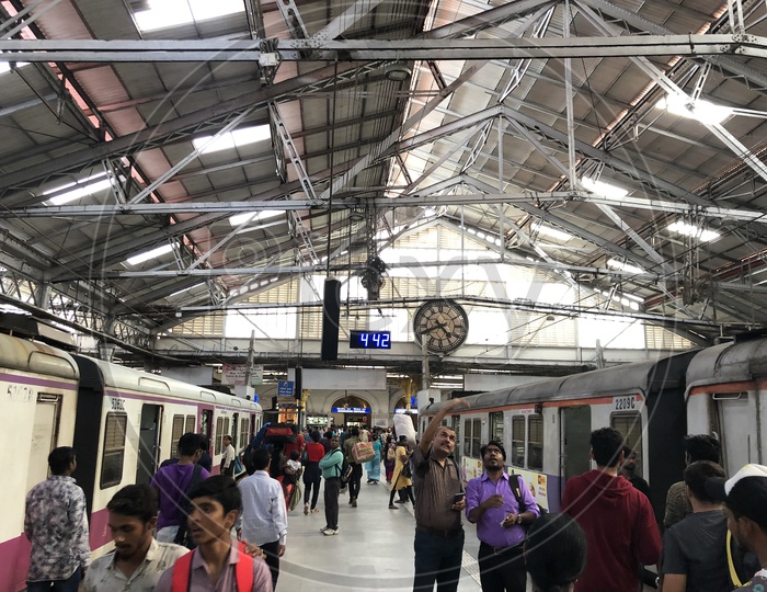 Commuters At Local Train Stations in Mumbai