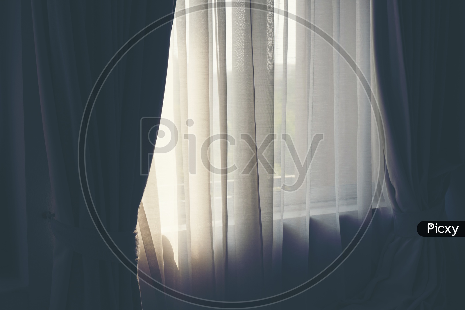 White curtains in a warm bedroom Window