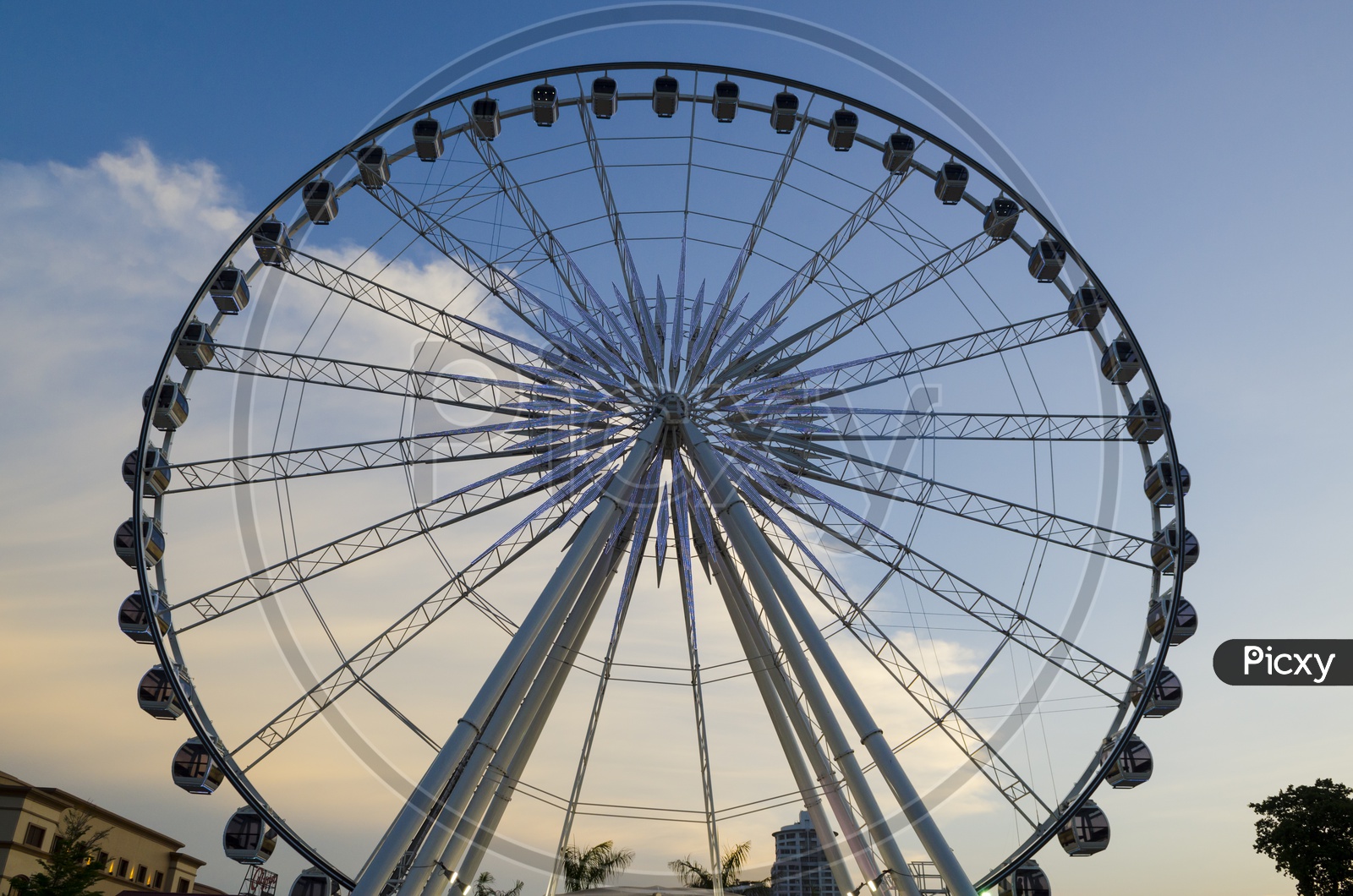 Beautiful large Ferris wheel With Sunset  Sky Background